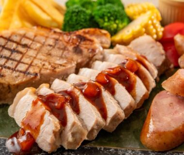Platter of grilled chicken, steak and sausages with vegetables at Spa Resort Hawaiians in Fukushima