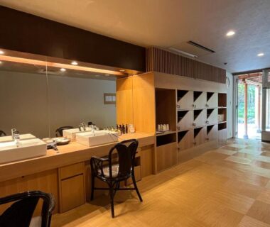 Wooden vanity with sinks, seating and cubby storage at Spa and Esthetique Suichokan Hokkaidō Japan