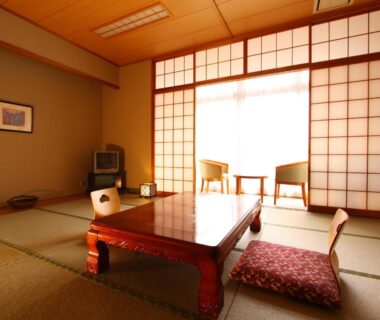 Traditional tatami room with low table, cushions and shoji screens at Spa&Resort Kujukuri Taiyou-no-sato Chiba