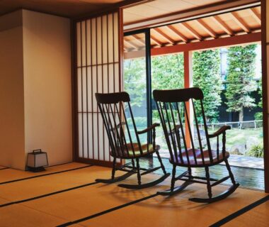 Tatami room with shoji screens and two wooden rocking chairs facing garden at Sui Suwako, Nagano