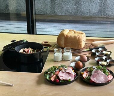 Table with bread, eggs, ham and condiments at Suigan ryokan Hokkaido Japan