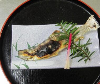 Whole grilled fish with herb garnish on plate at Suisensou, Gifu, Chūbu Japan