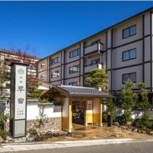Entrance gate and signage at Suiun with landscaped frontage and multi-story building in Kanagawa, Kantō