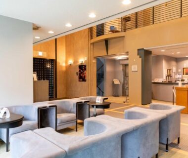Suizansou lobby with curved sofas, reception desk, wooden lattice and warm lighting in Hyōgo, Kansai