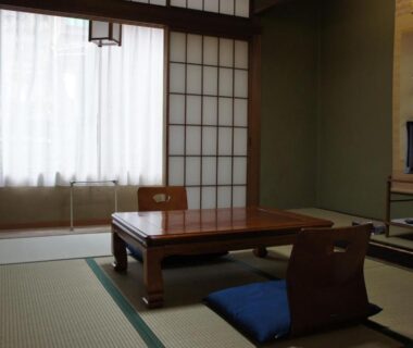 Tatami room with low table and zabuton cushions at Sumiyoshiya in Ishikawa, Chūbu, Japan