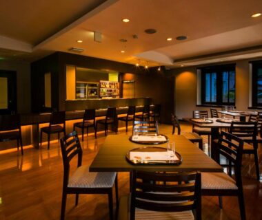 Warm wooden dining area with set tables at Sundance Resort Hakone Gora, Kanagawa, Japan