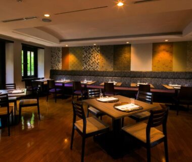 Warm wooden dining room with set tables at Sundance Resort Hakone Gora, Kanagawa, Japan