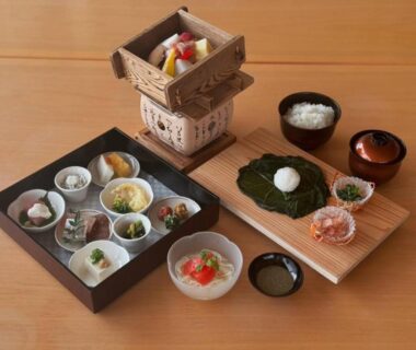 Multi-dish Japanese meal set with lacquer tray, rice bowl, miso soup and wooden steamer Sunrise Katsuura Wakayama