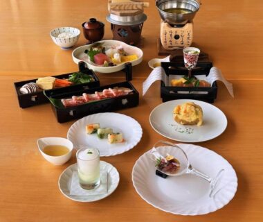 Assorted small Japanese dishes on lacquer trays at Sunrise Katsuura in Wakayama, Kansai