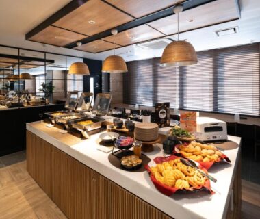 Buffet breakfast spread with pastries and hot dishes at Super Hotel Asahikawa in Hokkaidō dining area