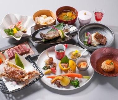 Assorted multi-course Japanese dishes and bowls arranged for a ryokan meal at Yado Kanzan, Gunma