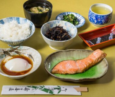 Breakfast set with grilled salmon, rice, miso soup, pickles and soft-cooked egg at Suzukisou Kyoto