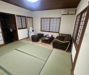 Traditional tatami room with low seating and shoji screens at Suzuya ryokan in Miyagi, Tōhoku, Japan