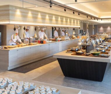 Spacious buffet dining hall with chefs preparing dishes and serving stations at TAOYA Gero in Gifu, Chūbu