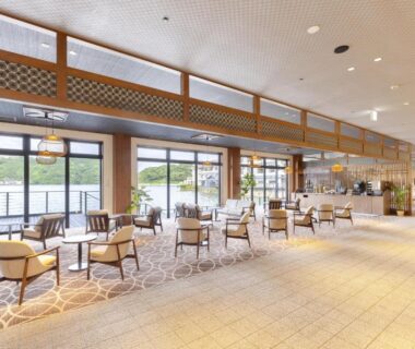 Airy lounge seating with floor-to-ceiling windows overlooking waterfront at TAOYA Nachikatsuura in Wakayama, Kansai