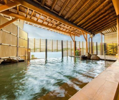 Wooden covered onsen with bamboo screens and seating at TAOYA Nachikatsuura, Wakayama