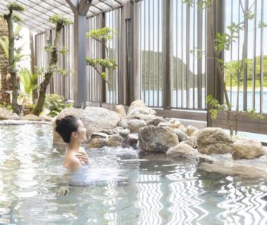Guest relaxing in indoor rock onsen at TAOYA Nachikatsuura in Wakayama, Kansai