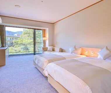 Twin beds room with large window and greenery at TAOYA Nasu Shiobara in Tochigi Kantō Japan