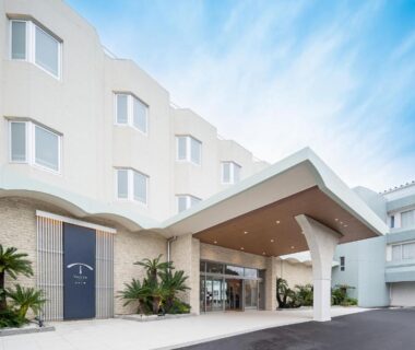 White multi-story facade with covered porte-cochere and palms at TAOYA Shirahama Senjyo, Wakayama, Kansai