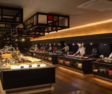 Buffet counter with chefs preparing dishes in modern dining hall at TAOYA Shirahama Senjyo, Wakayama