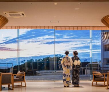 Two guests in yukata at lobby window overlooking coastal view TAOYA Shirahama Senjyo Wakayama