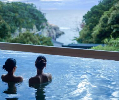 Two guests in a coastal ryokan bath at TAOYA Shirahama Senjyo, Wakayama