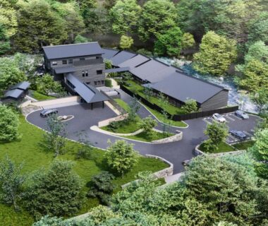 Aerial view of wooded ryokan complex with multiple buildings and winding drive at THE YUKAWA Ichijoh Branch Miyagi