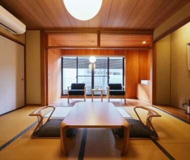 Traditional tatami room with low table and balcony seating at TSUCHIYA Kinosaki onsen, Hyōgo, Kansai