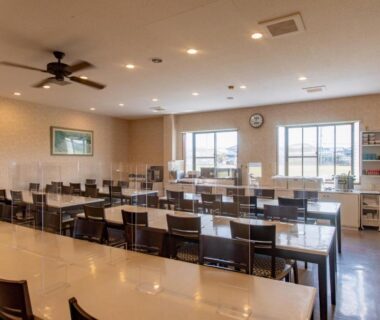 Spacious communal dining room with tables and chairs at Tabist Daibou Ichihara Mens Only in Chiba, Kantō