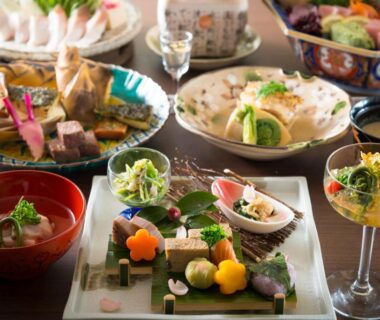 Assorted small Japanese dishes with sashimi and lacquerware at Tachibana Shikitei in Ishikawa