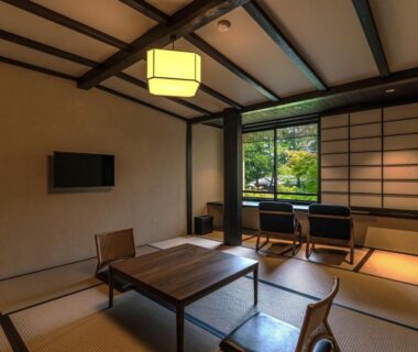 Tatami room with low table and shoji screens at Taikyourou in Kyoto