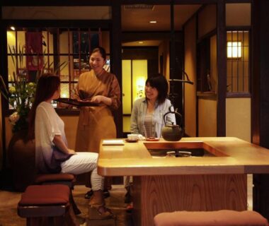 Traditional interior with server in kimono serving guests at Taikyourou Kyoto