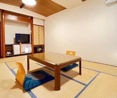 Tatami room with low table and floor chairs at Taiyokan, Gunma Kanto