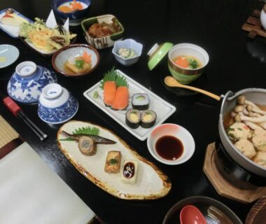 Assorted Japanese dishes on low table with tatami seating at Tajimaya, Gifu, Chūbu