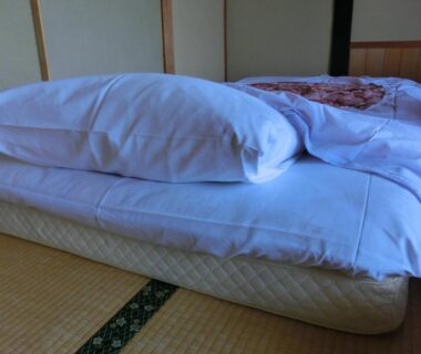 Folded futon on tatami mat at Tajimaya ryokan in Gifu, Chūbu Japan