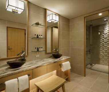 Double vessel sinks on marble counter with mirrors and walk-in shower at Takanawa Hanakohro Tokyo