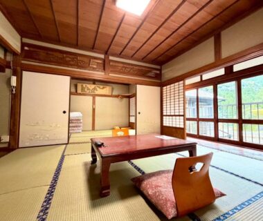Tatami room with low table, zaisu chair and shoji screens, Takaosou, Ōita, Kyūshū, Japan
