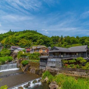 Riverside wooden buildings beside a cascading stream at Takaosou, Ōita, Kyūshū, Japan