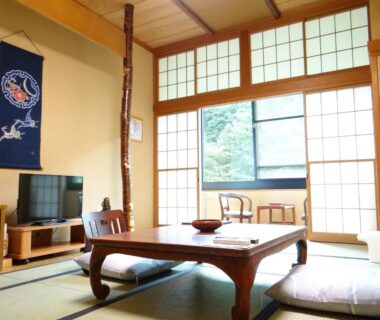 Tatami room with low table and shoji screens at Takaragawa Onsen Ousenkaku in Gunma Kanto