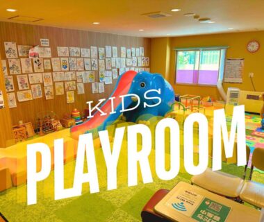 Bright children's playroom with large blue elephant toy and drawings on the wall at Takasago Onsen, Hokkaidō