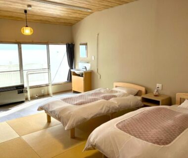 Tatami room with twin beds at Takasagoya Ryokan in Yamagata Tōhoku