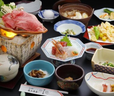 Assorted traditional Japanese dishes arranged for a ryokan dinner at Takasagoya Ryokan in Yamagata