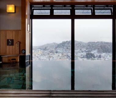 Indoor hot spring bath at Takayama Ouan overlooking Takayama town and hills, Chūbu Gifu Japan