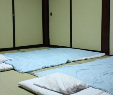 Low futon bedding on tatami floor with fusuma screens at Tamonkan ryokan in Yamagata Tōhoku