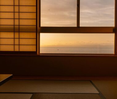 Tatami-floored room with shoji screens and sea view at Tanoura Onsen Kaikatei Kawai, Niigata