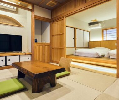 Tatami room with low table and shoji screens at Tawarayama Onsen Ryokan Minawa, Kumamoto, Kyūshū