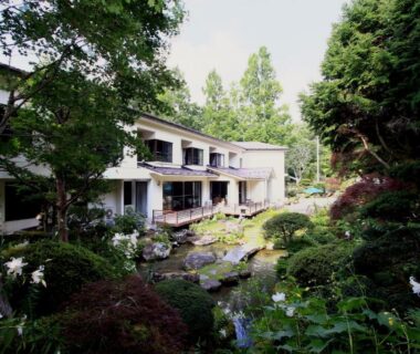 White ryokan building and pond at Teiensaryo Yamanakako, Yamanashi
