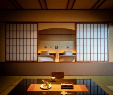 Traditional tatami room with low table, shoji screens and alcove at Tendo Onsen TAKINOYU Yamagata