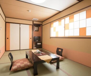 Traditional tatami room with low table and zaisu chairs at Tenpyo Ryokan in Nara