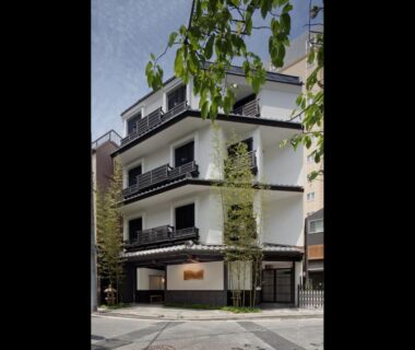 Street-level view of The Edo Sakura exterior with balconies and bamboo in Tokyo, Kantō
